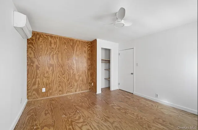 a view of empty room with ceiling fan