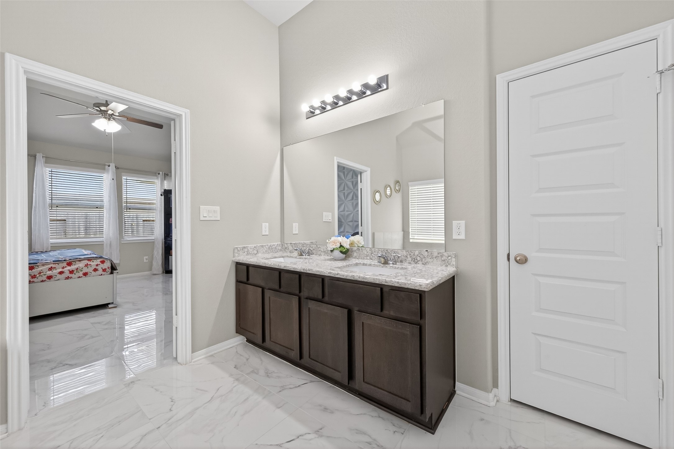 22409 Kinley Street New Caney, TX 77357 - Photo 32 of 46 a bathroom with a double vanity sink and a mirror