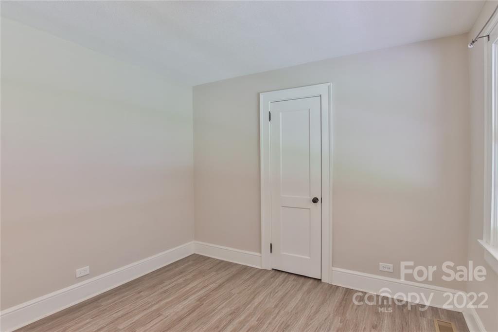 263 McCrary Place Lenoir, NC 28645 - Photo 13 of 40 a view of an empty room with wooden floor