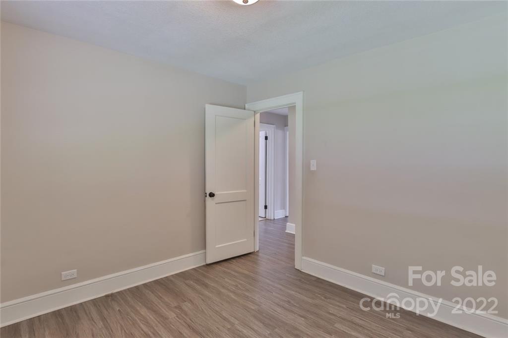 263 McCrary Place Lenoir, NC 28645 - Photo 14 of 40 a view of an empty room and wooden floor