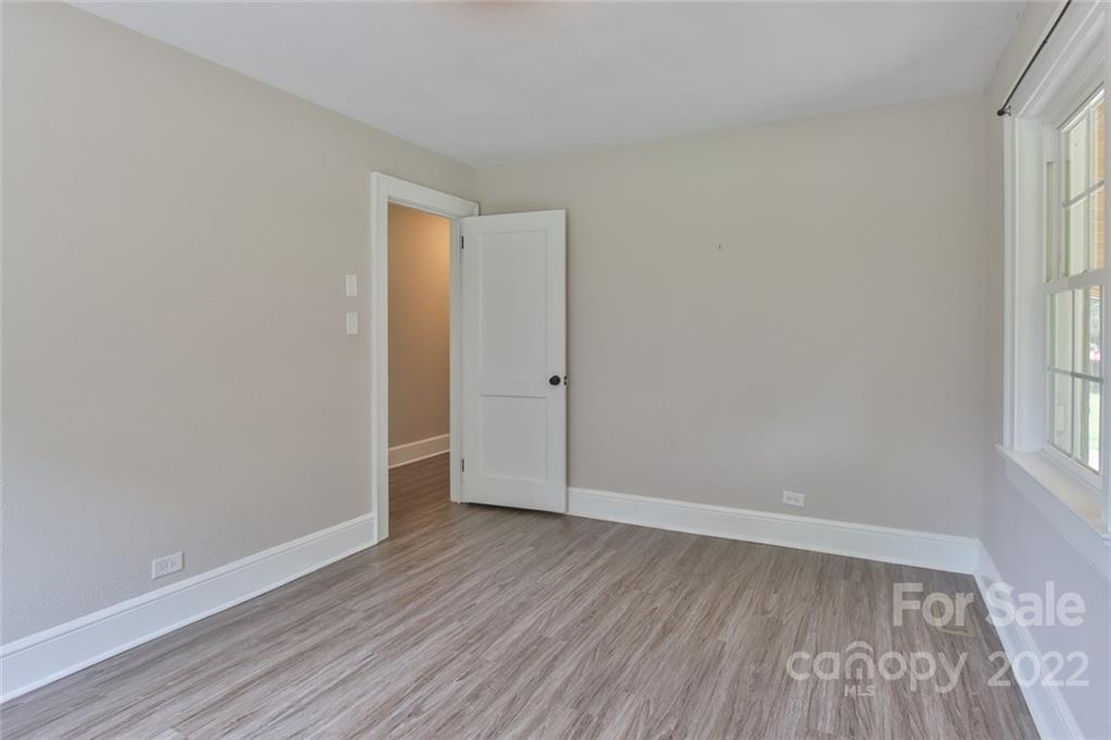 263 McCrary Place Lenoir, NC 28645 - Photo 15 of 40 an empty room with wooden floor and windows