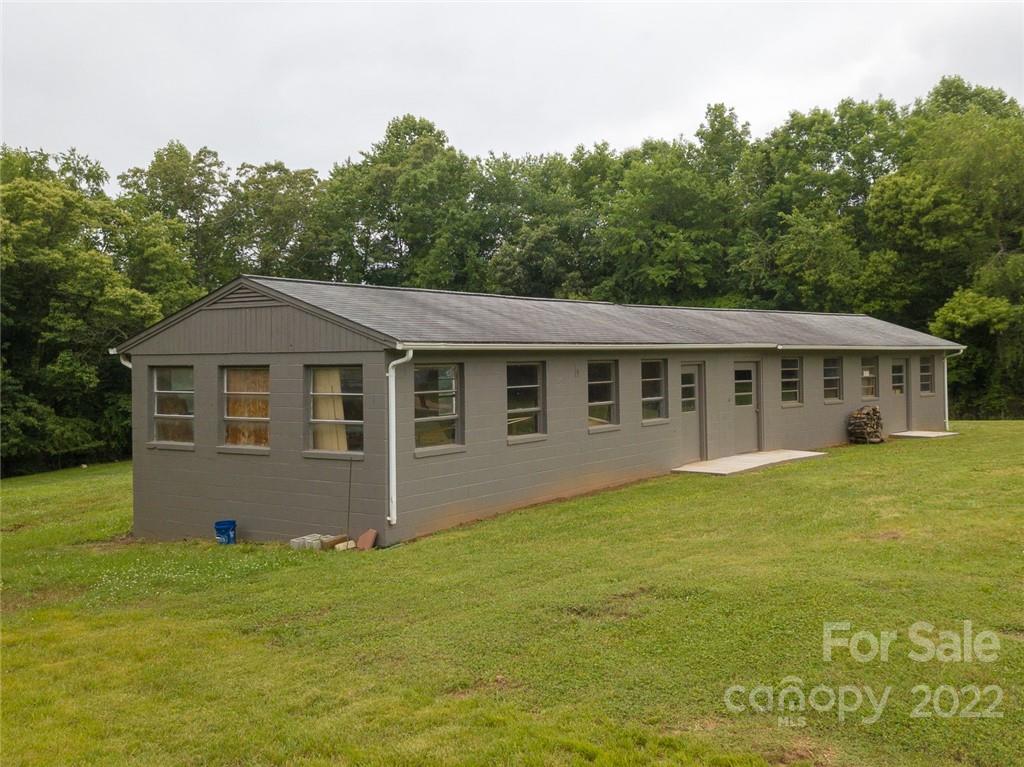 263 McCrary Place Lenoir, NC 28645 - Photo 35 of 40 a front view of house with yard and trees in the background
