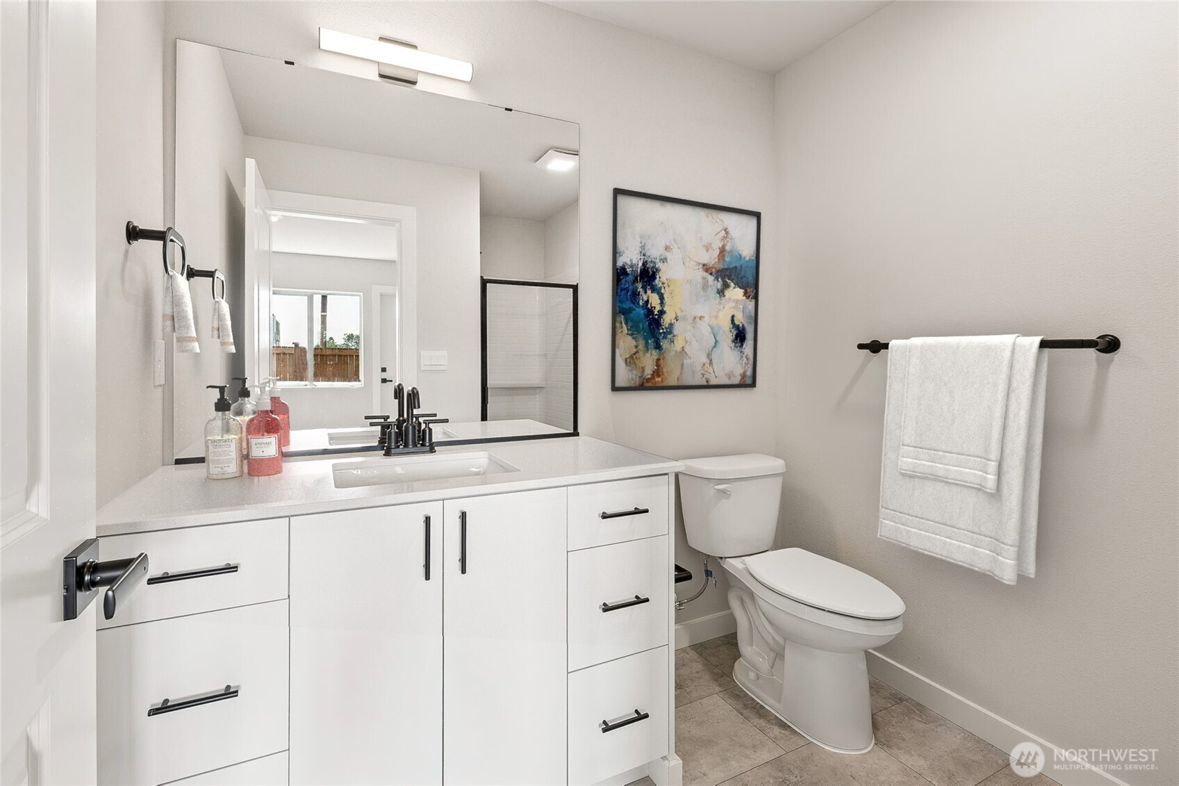 14707 87th Avenue Southeast, Unit DD6 Snohomish, WA 98296 - Photo 16 of 17 a bathroom with a toilet sink and mirror