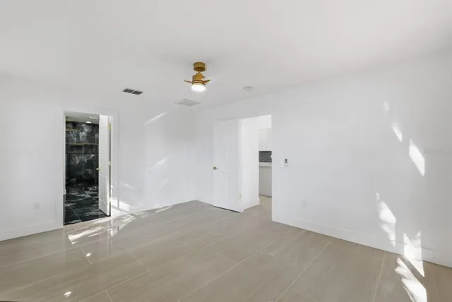 a view of an empty room with a window