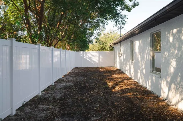 a backyard of a house with lots of green space