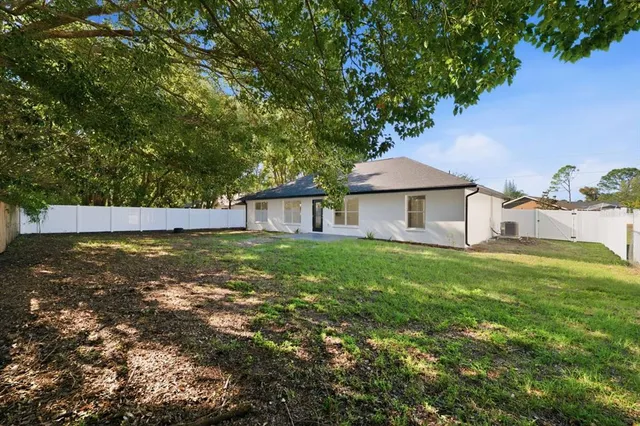 a view of backyard with green space