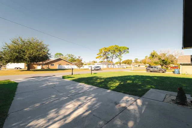 a view of a house with a yard