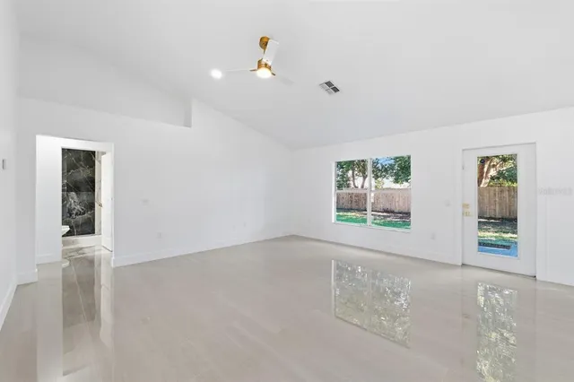 a view of an empty room with a window