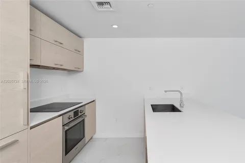 a kitchen with a stove and a microwave