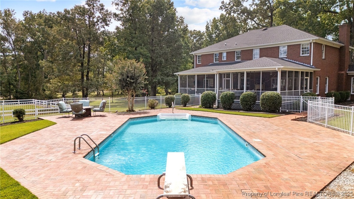 387 3 Bridge Road Dunn, NC 28334 - Photo 11 of 49 a view of a house with swimming pool