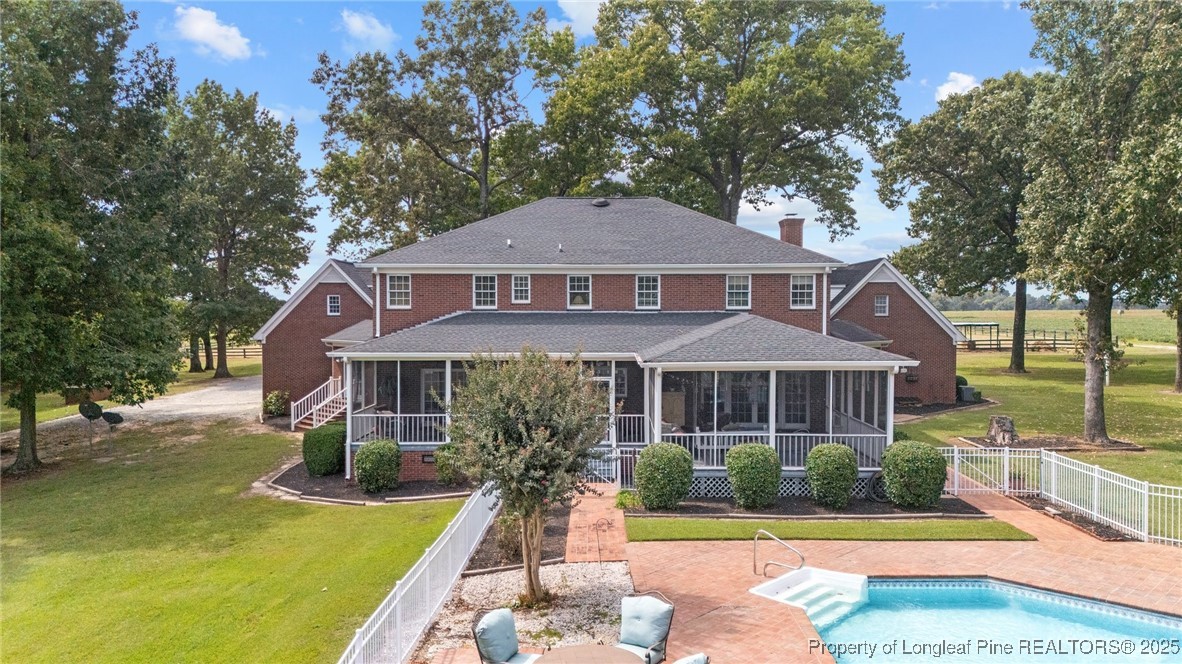 387 3 Bridge Road Dunn, NC 28334 - Photo 12 of 49 a front view of a house with a yard