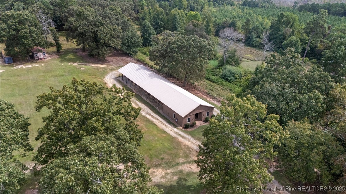 387 3 Bridge Road Dunn, NC 28334 - Photo 14 of 49 a view of a yard with an outdoor seating