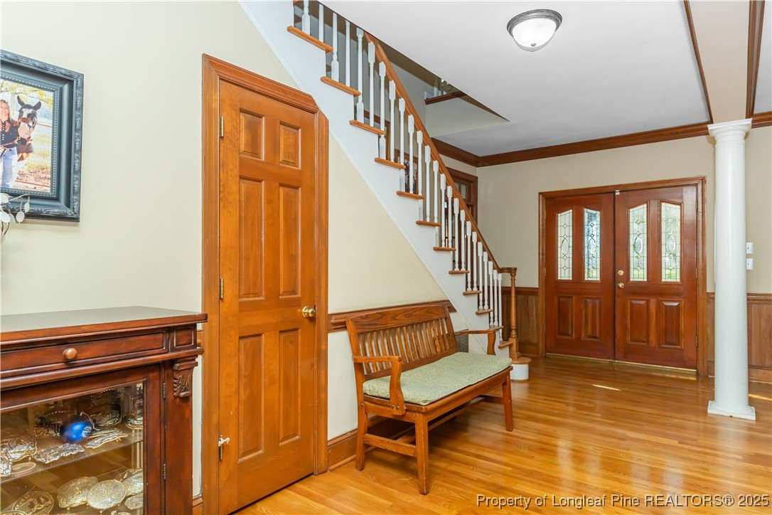 387 3 Bridge Road Dunn, NC 28334 - Photo 19 of 49 a view of entryway livingroom and hall with wooden floor