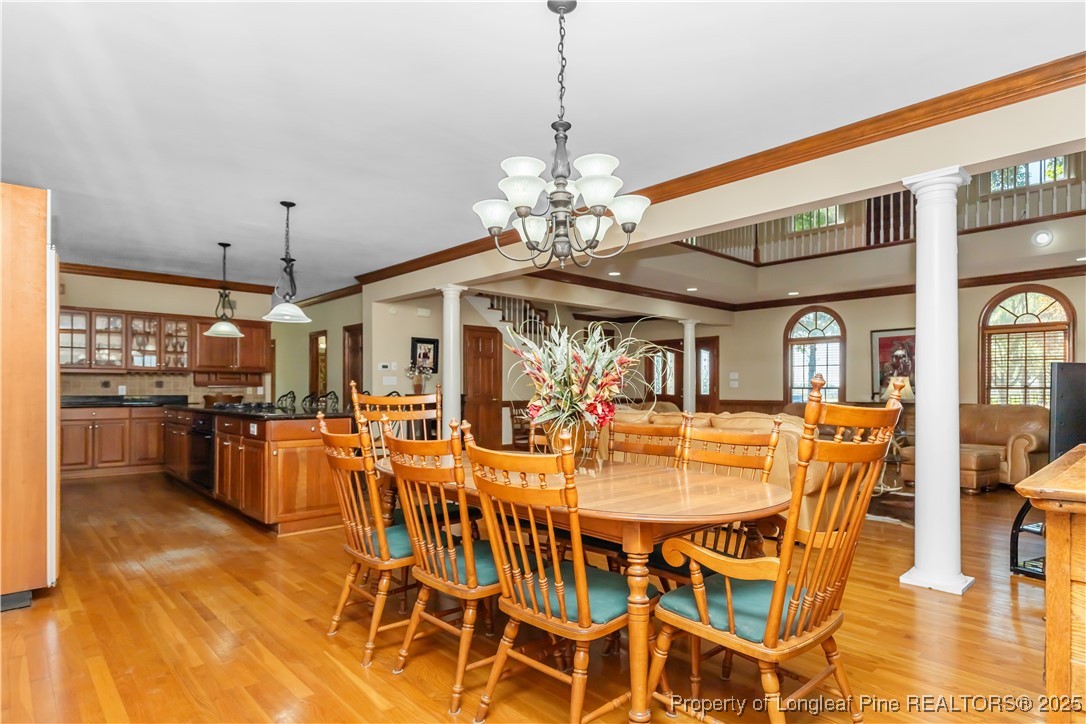 387 3 Bridge Road Dunn, NC 28334 - Photo 26 of 49 a view of a dining room with furniture and chandelier