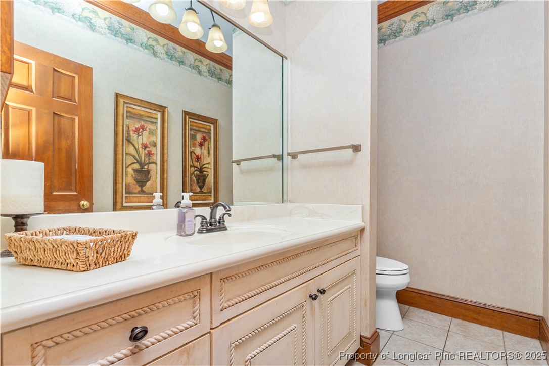 387 3 Bridge Road Dunn, NC 28334 - Photo 28 of 49 a bathroom with a granite countertop sink and a mirror