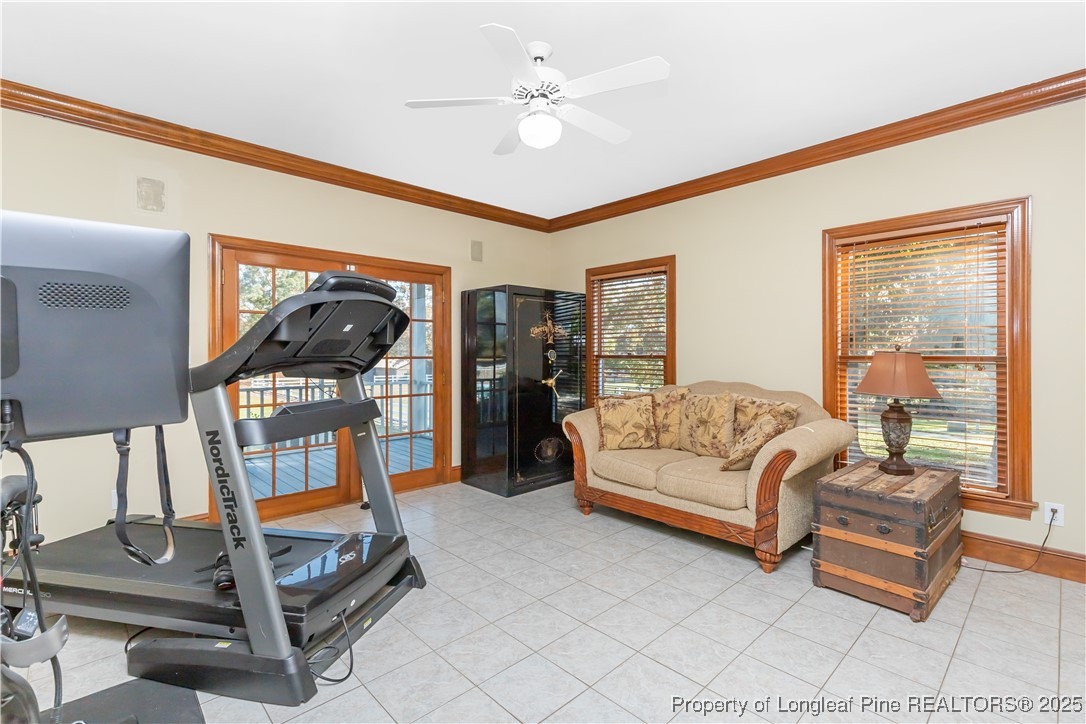 387 3 Bridge Road Dunn, NC 28334 - Photo 29 of 49 a living room with furniture a rug and white walls