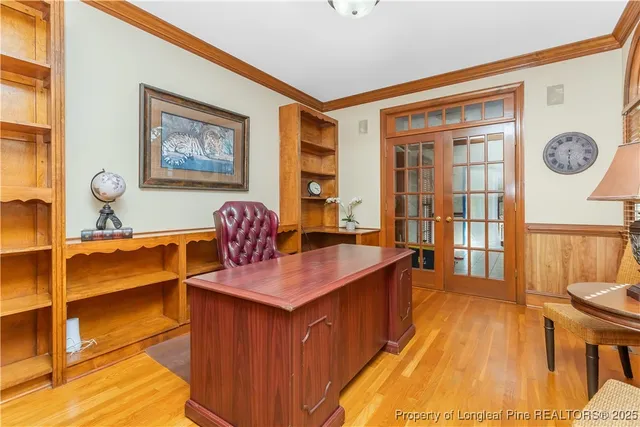 a hallway with a large windows sink and wooden floor
