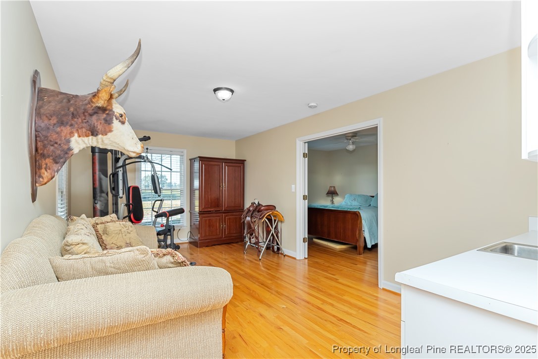 387 3 Bridge Road Dunn, NC 28334 - Photo 34 of 49 a living room with furniture and a wooden floor