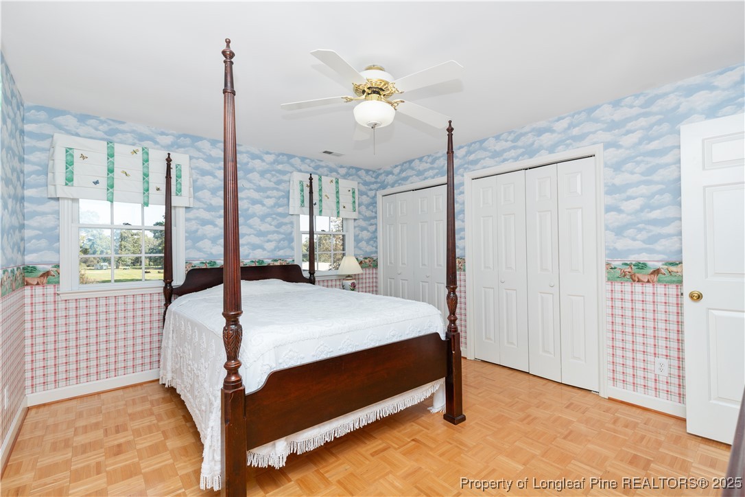 387 3 Bridge Road Dunn, NC 28334 - Photo 45 of 49 a bed sitting in a spacious bedroom next to a window