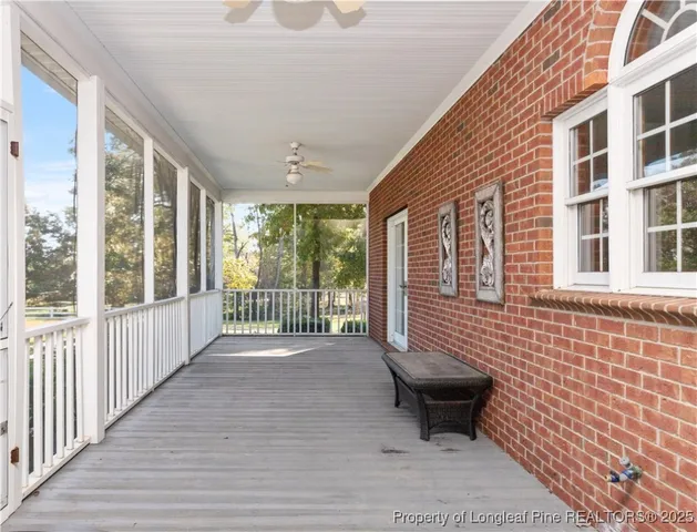 a view of a porch with wooden floor and outdoor space