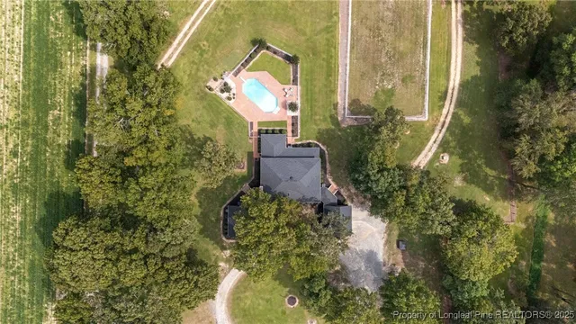 a aerial view of a house with a yard
