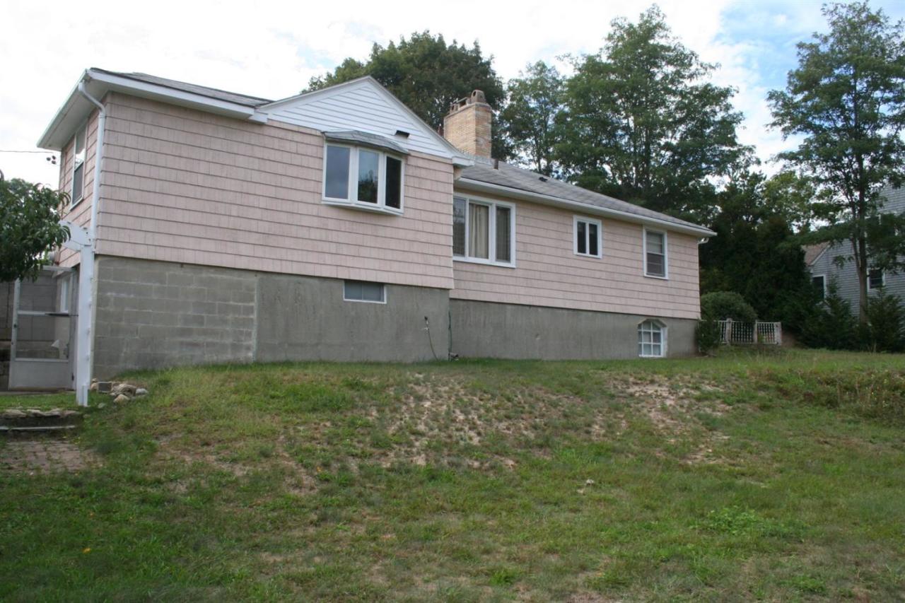 1225 County Road Cataumet, MA 02534 - Photo 4 of 24 a front view of a house with garden