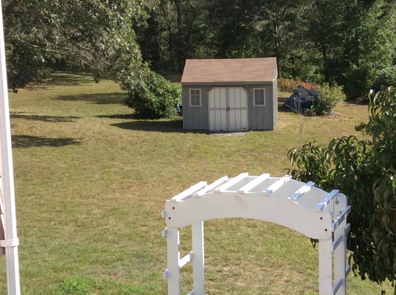 1225 County Road Cataumet, MA 02534 - Photo 6 of 24 a front view of a house with a yard