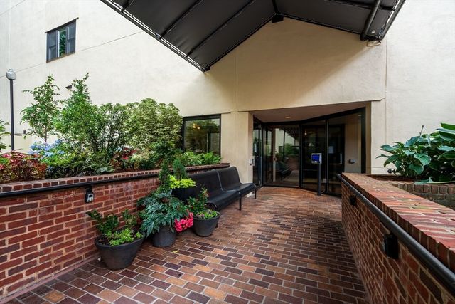 a view of a chairs and table in the patio