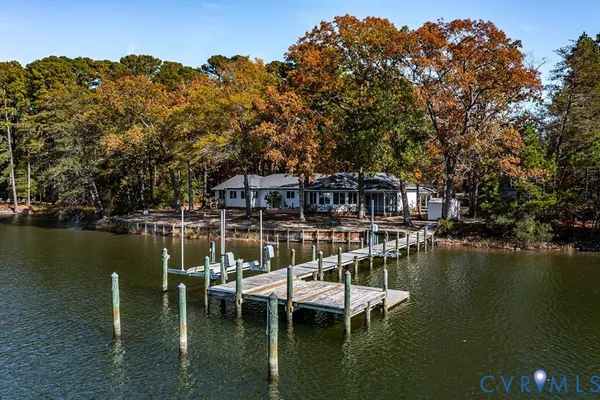 a view of a lake with boats and trees in the background