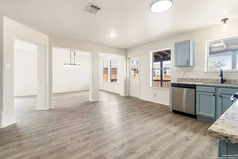 a view of a kitchen counter space and wooden floor