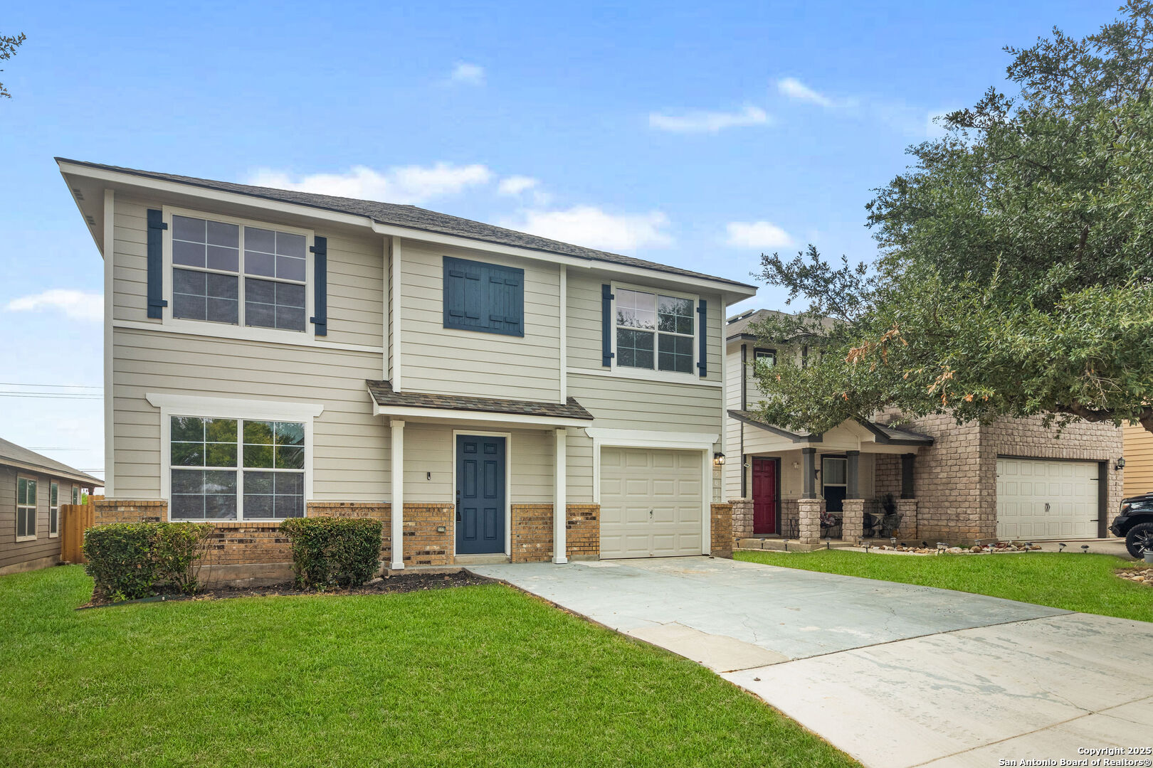 5015 Badland Beacon Converse, TX 78109 - Photo 2 of 23 a front view of a house with a garden and yard