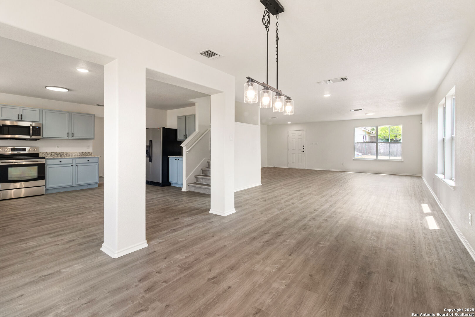 5015 Badland Beacon Converse, TX 78109 - Photo 7 of 23 a view of a room with wooden floor and window