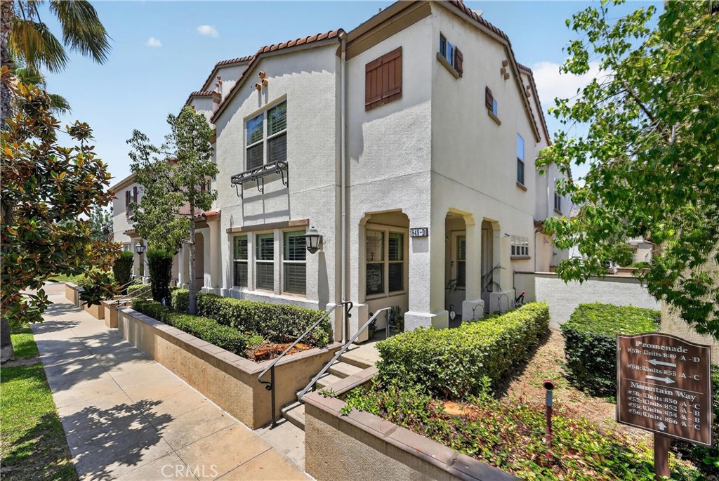 849 The Promenade, Unit D Azusa, CA 91702 - Photo 2 of 37 a front view of a house with garden