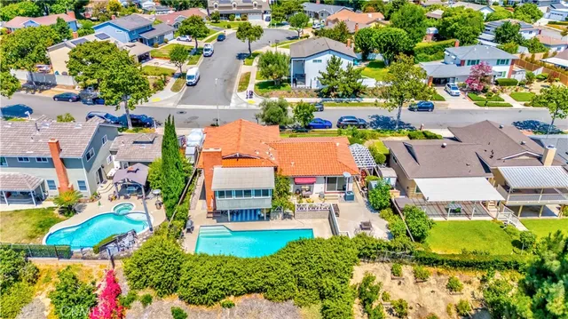 an aerial view of multiple houses with yard