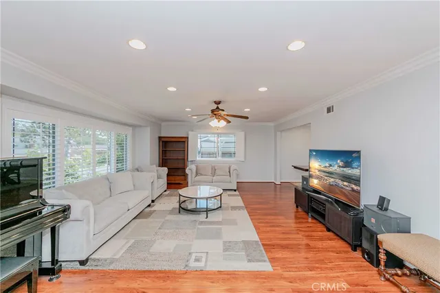 a living room with fireplace furniture and a flat screen tv