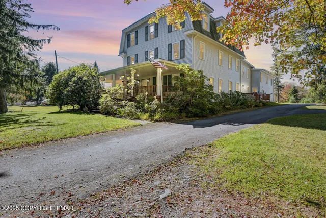 a bathroom with a sink a large mirror and a shower