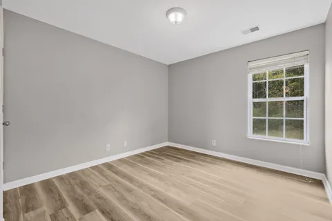 a white toilet sitting next to a bath tub