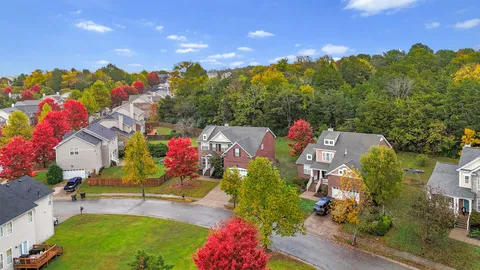an aerial view of a houses with yard
