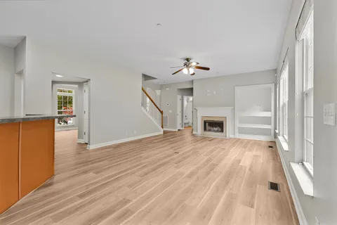 a view of a room with racks on the wall and a window