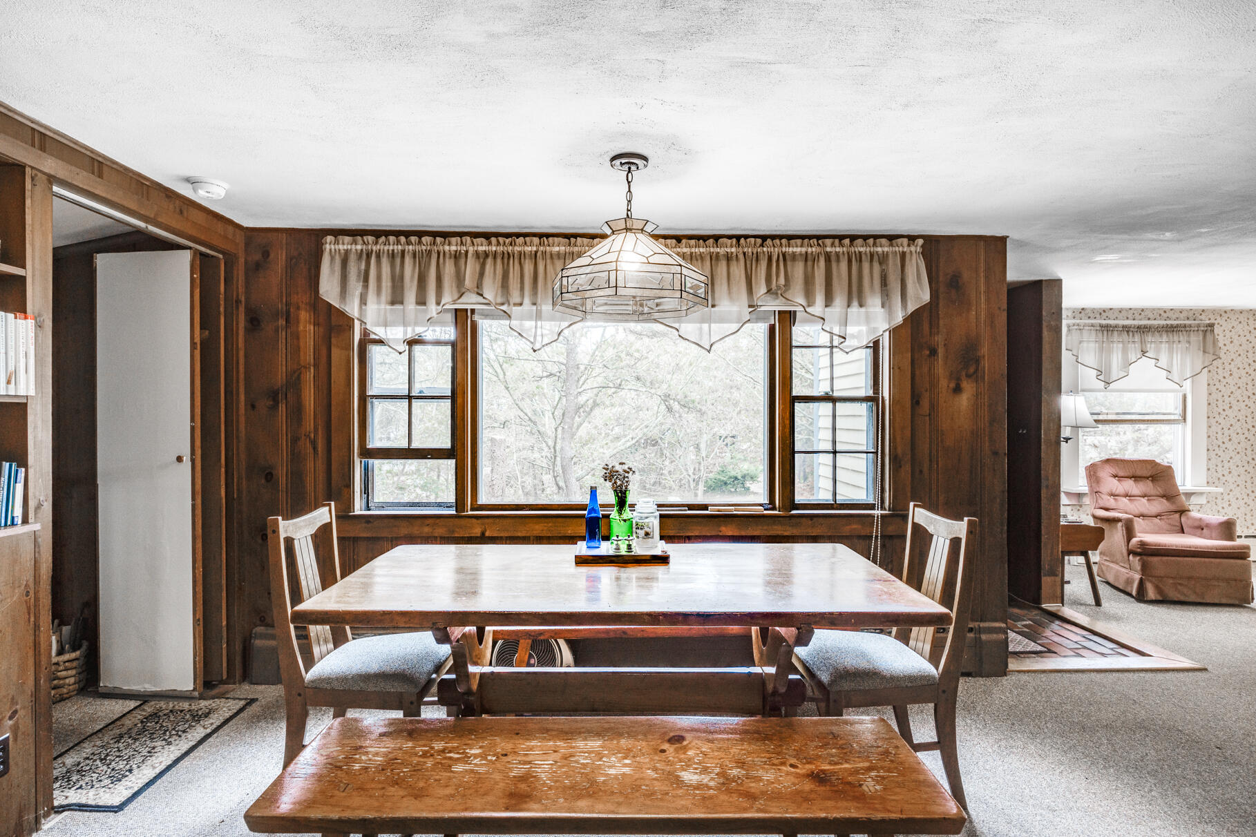 25 1st Avenue Wellfleet, MA 02667 - Photo 18 of 56 a dining room with wooden floor and large window