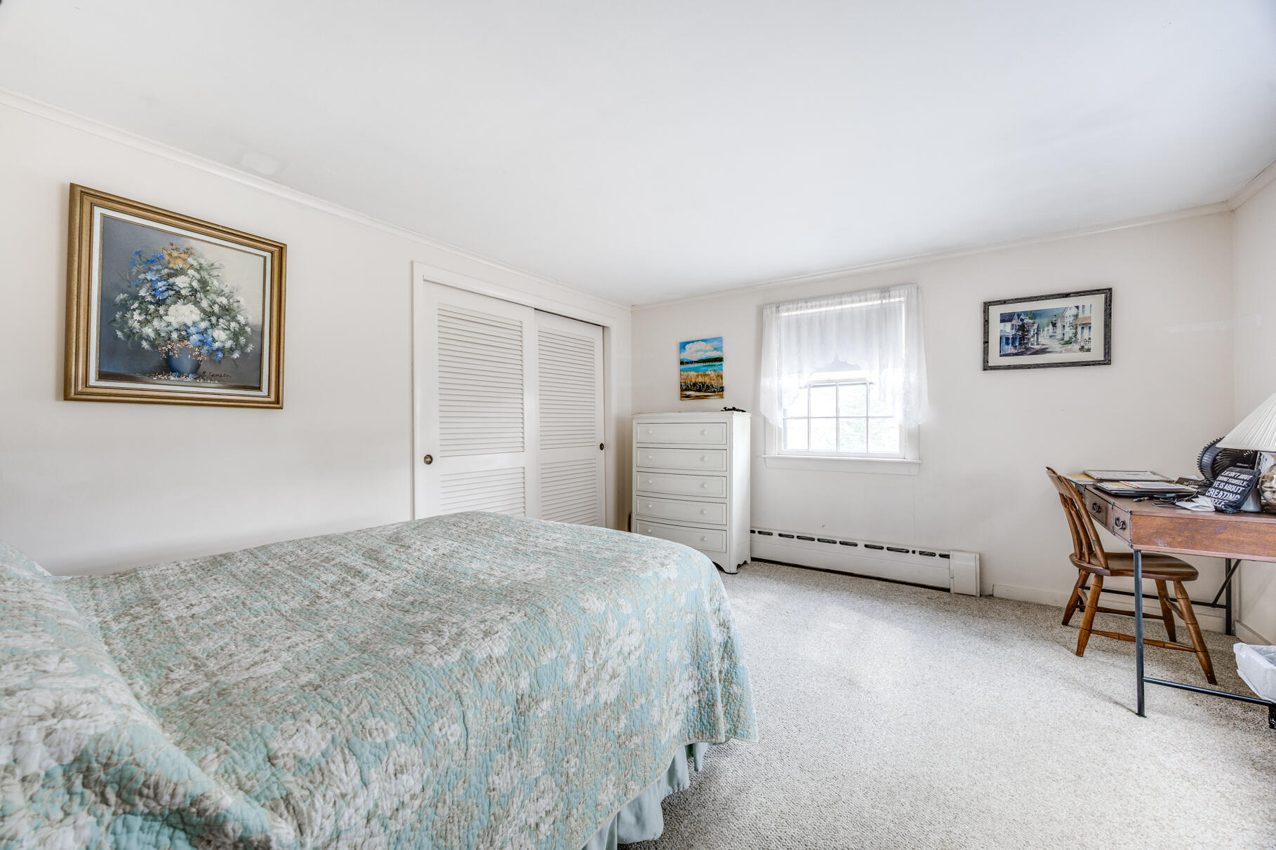 25 1st Avenue Wellfleet, MA 02667 - Photo 24 of 56 a spacious bedroom with a bed and a desk