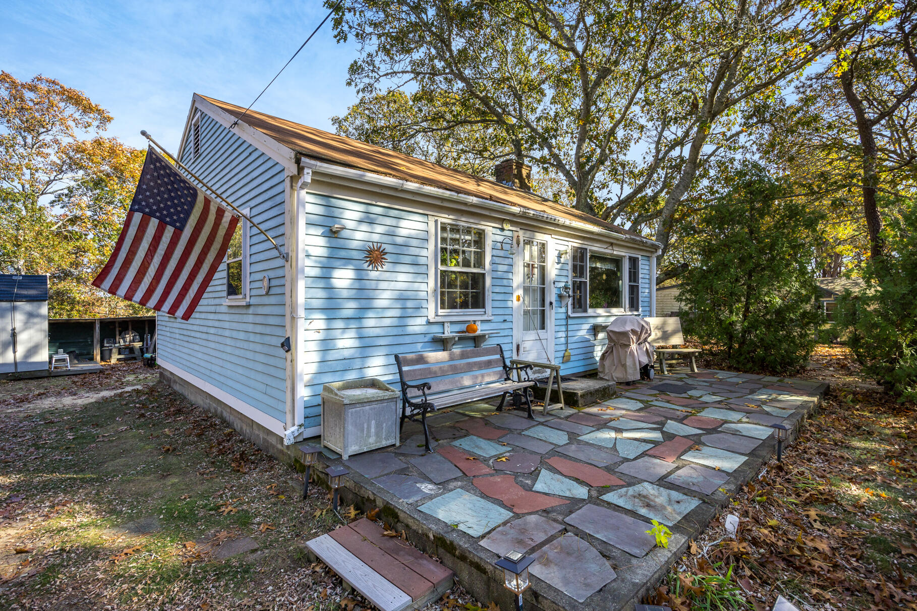 25 1st Avenue Wellfleet, MA 02667 - Photo 27 of 56 a backyard of a house with outdoor seating