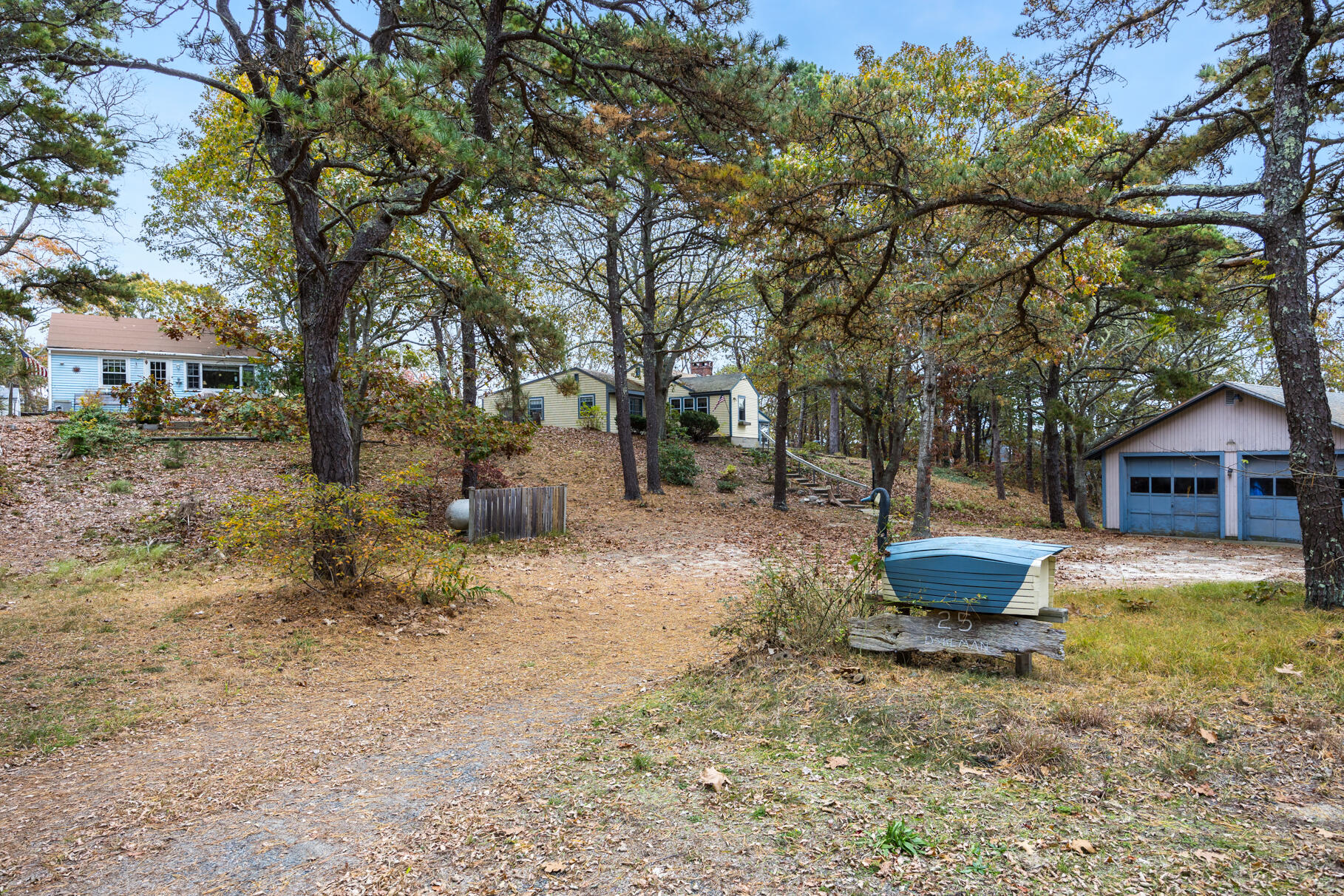 25 1st Avenue Wellfleet, MA 02667 - Photo 40 of 56 a backyard of a house with fountain and barbeque oven