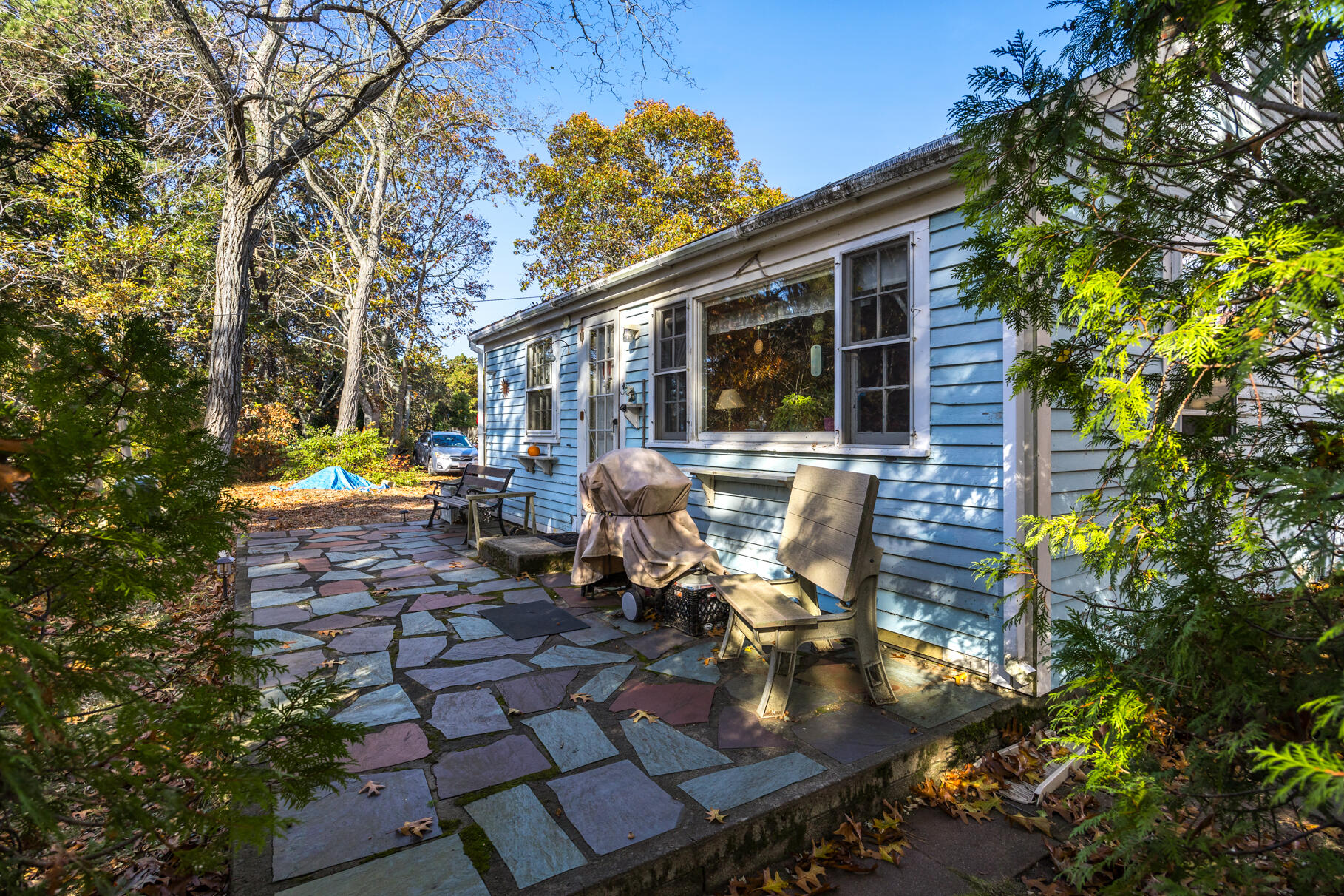 25 1st Avenue Wellfleet, MA 02667 - Photo 9 of 56 a view of a patio with table and chairs and potted plants