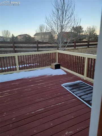a terrace view with wooden floor and city view
