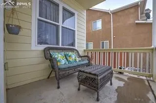 a view of a porch with furniture