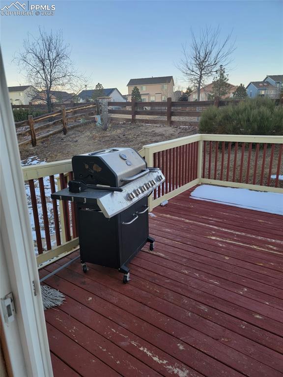 12264 Point Reyes Drive Peyton, CO 80831 - Photo 21 of 24 a view of a roof deck with wooden floor and fence