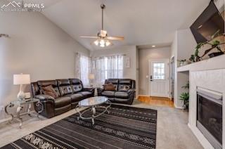 12264 Point Reyes Drive Peyton, CO 80831 - Photo 4 of 24 a living room with furniture a fireplace and a flat screen tv
