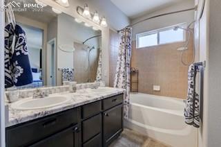 12264 Point Reyes Drive Peyton, CO 80831 - Photo 6 of 24 a bathroom with a granite countertop bathtub a sink and a shower