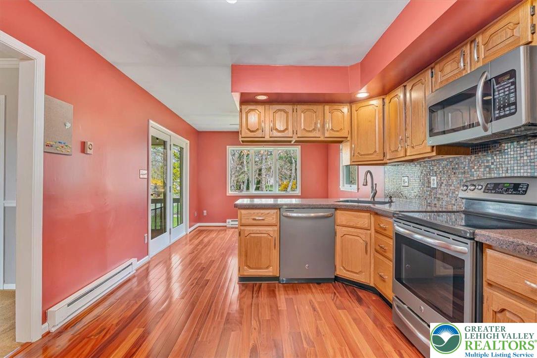 1210 Bluestone Drive Bethlehem, PA 18017 - Photo 20 of 84 a kitchen with stainless steel appliances granite countertop a stove a sink and a refrigerator